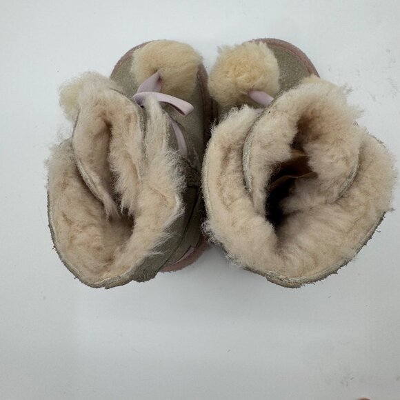 UGG Infant Girls Metallic Gold Sheepskin Bow Booties With Pom-Poms - Picture 9 of 11